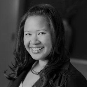 MyKim Tran's headshot in black and white in office space.