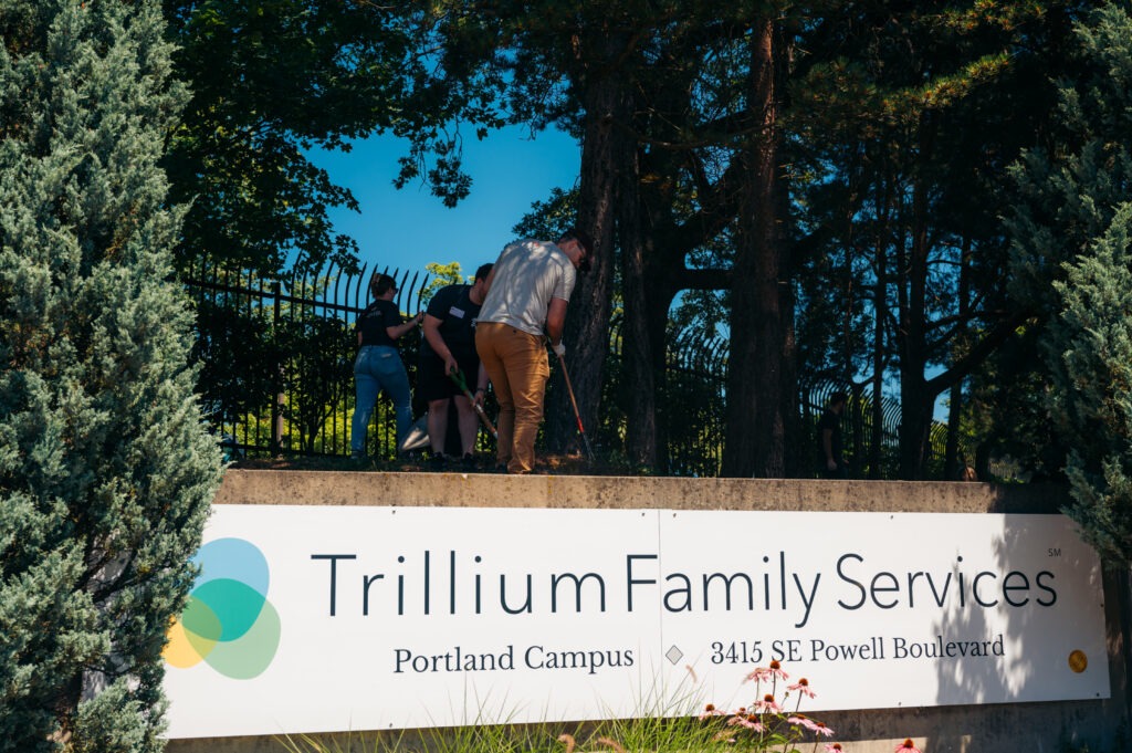Aldrich employees improving the grounds at Trillium Family Services on Action Day, Aldrich's annual day of service