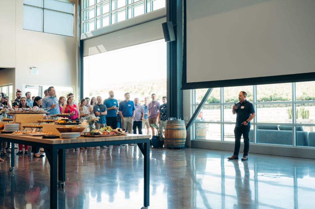 John Lauseng, Partner + CEO, toasting Aldrich's 50th anniversary at Stoller Family Estate.