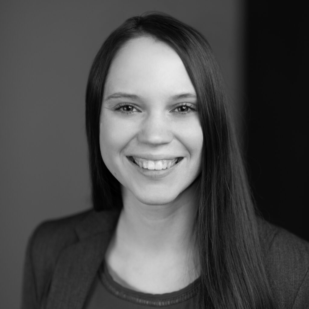 Leah Anderson's headshot in black and white in office space.